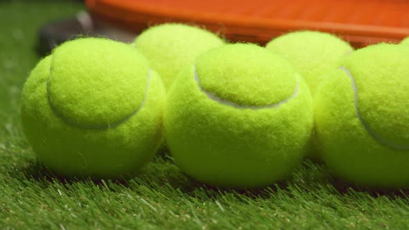 Group of Tennis Balls on Grass Background Close Up