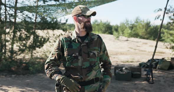 Soldier Military Territorial Defense Team Man Dressed in Moro Clothes Black Glasses Stands Against