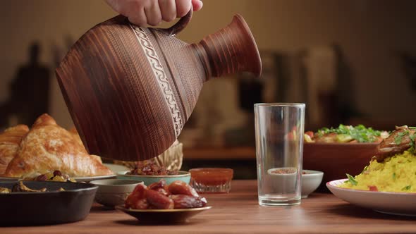 Pouring Juice Muslim Family Dinner Ramadan Iftar