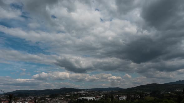 Aerial View of White Clouds Flying Across the Blue Sky