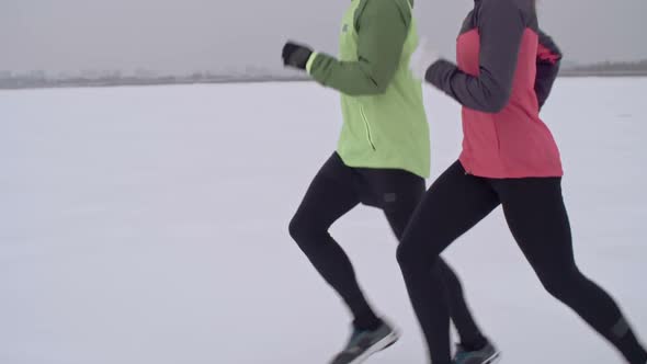 Couple Running Winter Marathon Together