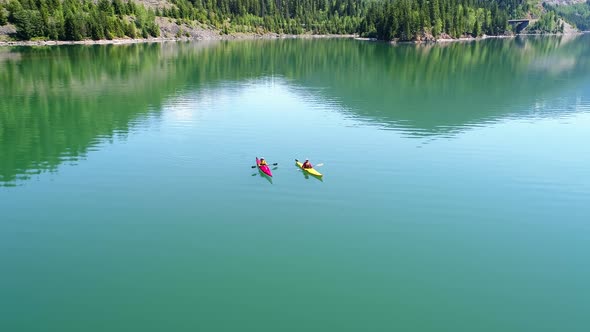 People kayaking in lake 4k