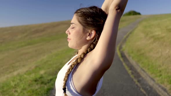 Slow motion shot of young woman doing yoga