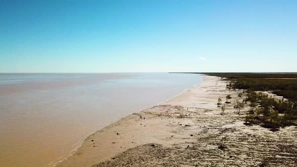 Forward and upward flying aerial shot of tidal mudflats in King Sound, Australia where the second la