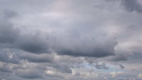 Dramatic storming dark rain clouds in the sky. Timelapse.