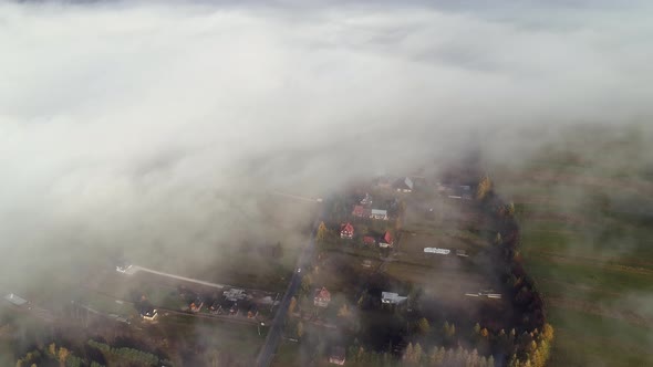 Countryside of Poland with blanket of ground clouds, thick mist, aerial