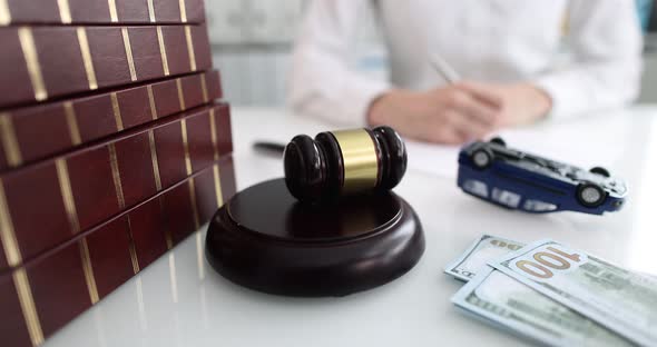 Judge Gavel with Upside Down Toy Car Closeup