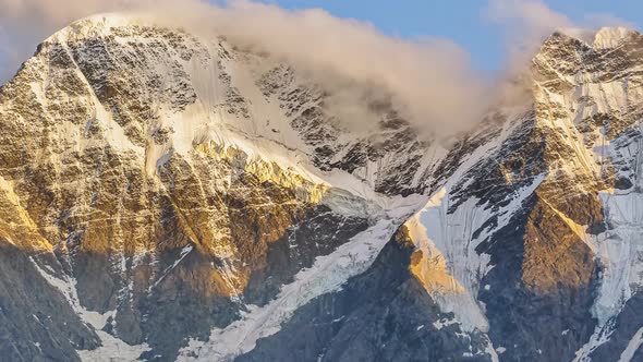 High Mountain Peak Covered with Snow From Morning Till Night