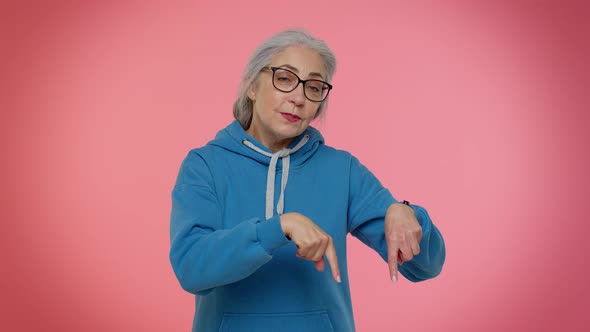 Senior Old Granny Woman Pointing Down Saying to Subscribe Gesturing Ok and Like Information Below