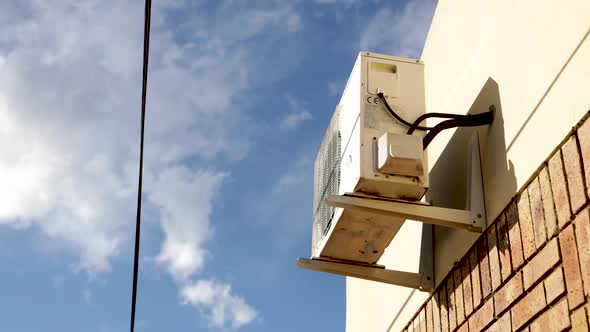 Timelapse Of An Airconditioning Unit Outside With Clouds Dancing alt