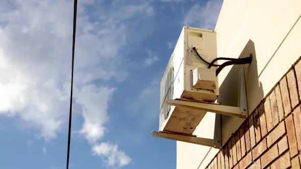 Timelapse Of An Airconditioning Unit Outside With Clouds Dancing