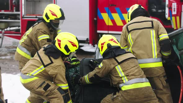 Firefighters Cutting Car Doors To Rescue Viction of the Car Crash Accident