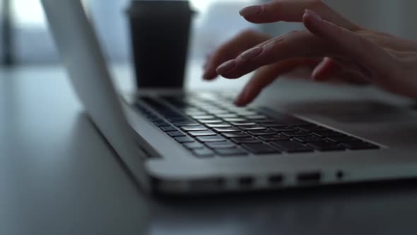 Tracking Shot Closeup of Hands of Unrecognizable Business Woman Using Typing on Laptop Keyboard