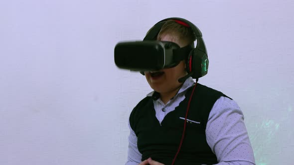 The Boy in the Augmented Reality Helmet Laughs and Opens His Mouth Wide