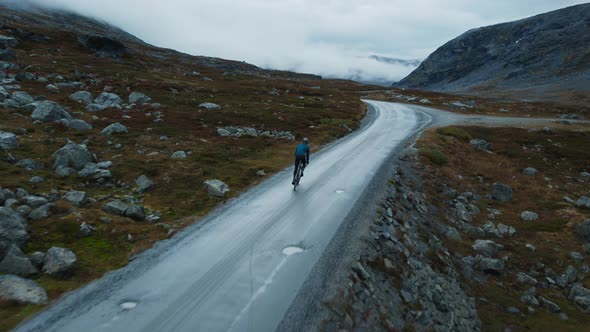 Stunning Flying Shot of Solo Cyclist Man on Road