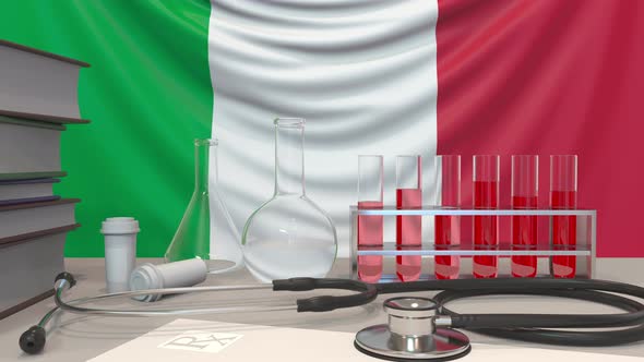 Laboratory Equipment on Italian Flag Background