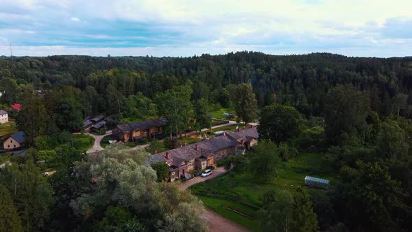 Old Wooden Houses Built for Paper Mill Workers in Ligatne. Wooden Row House 4K Aerial Shot	