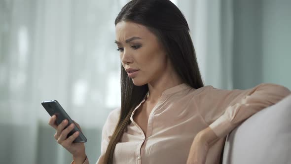 Frustrated Girl Having Issues With Outdated App, Unsatisfied With Phone Software