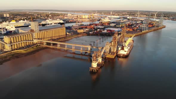 Aerial view of Port of Tilbury, with boats and cruise ships moored at sunset