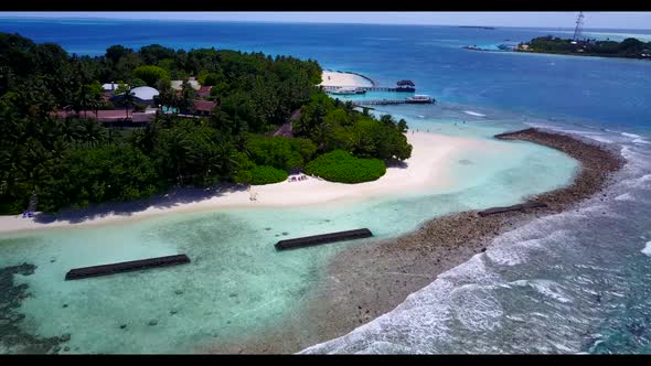 Aerial abstract of exotic tourist beach trip by blue ocean with white sandy background of a dayout n