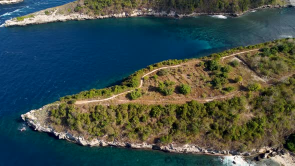 Fly Around Cliff and Rocks Over Ocean Along Coast