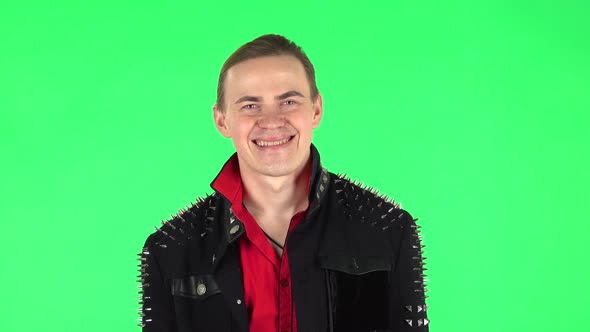 Guy Smiles Broadly and Winks . Green Screen