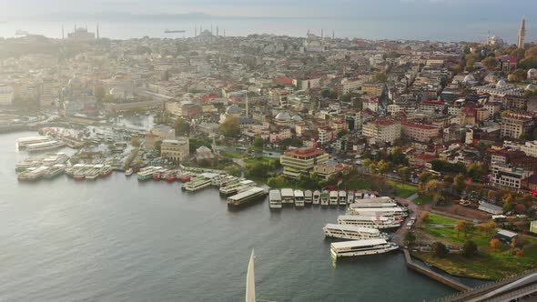 Aerial view of ferry boats docked on the Bosphorus River during a colorful and vibrant morning sunri