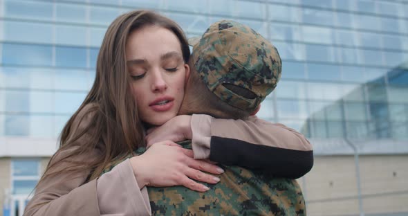 Close Up of Woman Embracing His Military Boyfriend.