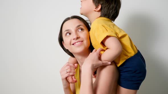 Mother with Her Son a Child of Three Years in Yellow T-shirts