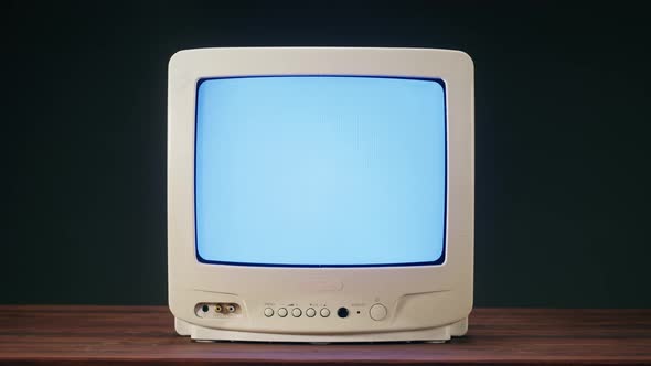 Old Television with Grey Interference Screen on Black Background