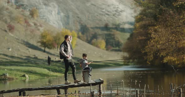 Playing Boy with a Big Fishing Rod, He Are with