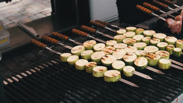 Zucchini Grilled on Skewers on the Open Barbecue at Food Court Vegan Shashlik