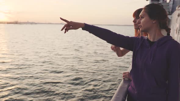 Two Young Beautiful Women Travel on a Ship and Spend a Good Time