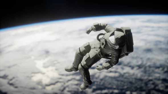 Astronaut Floating Above the Earth Elements of This Image Furnished By NASA