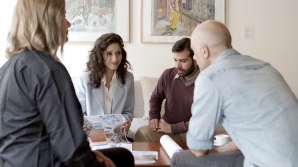 Interior Designer Talking with Clients at Home