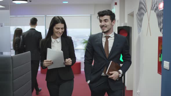 Successful businessman walking through the office building