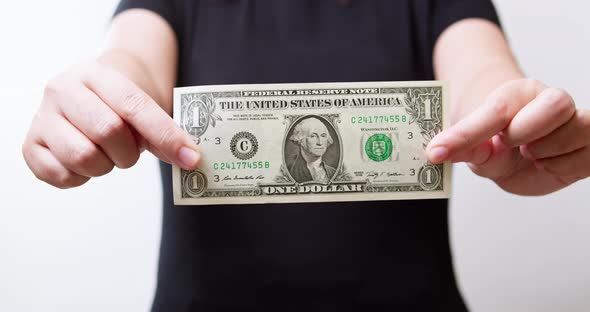 Women Holding American Dollar Currency