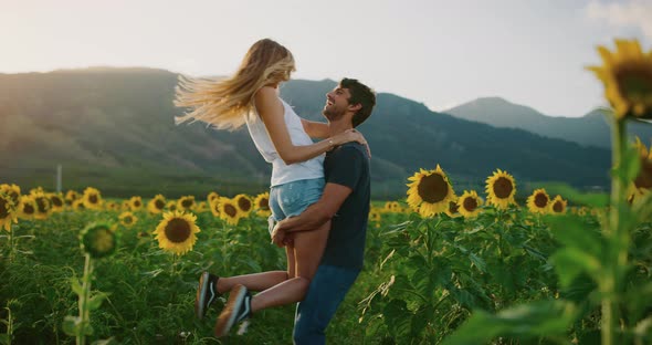 Happy couple in sunflower fields