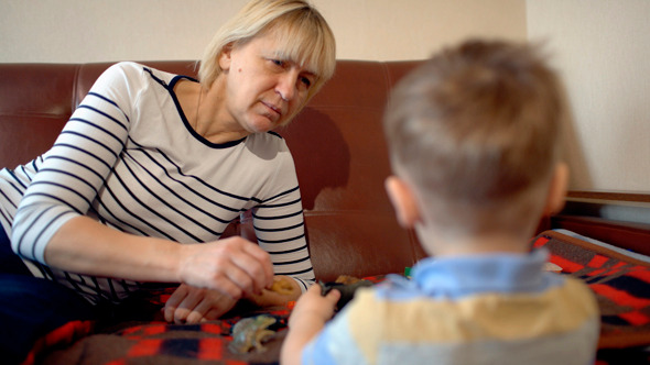 Grandmother And Granson Playing With Toys