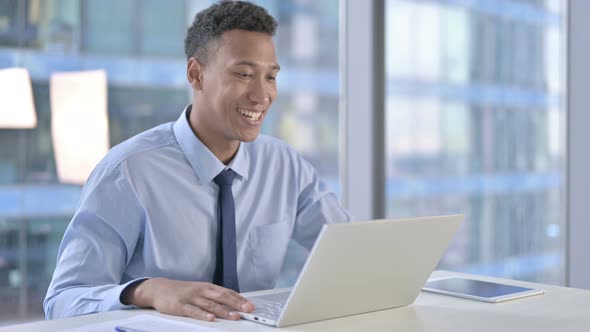 African American Businessman Doing Video Chat on Laptop 