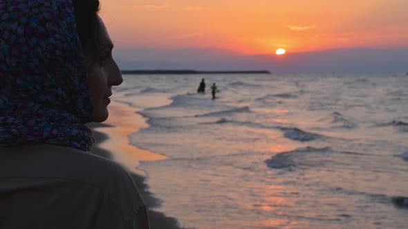 Woman Watch Sunset In Caspian Sea Coast