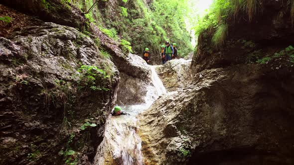 Aerial view of a group of people canyoning in Soca river, Slovenia