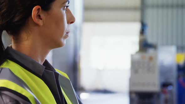 Worker standing with arms crossed