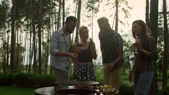 Relaxed People Eating French Beans in Summer Forest