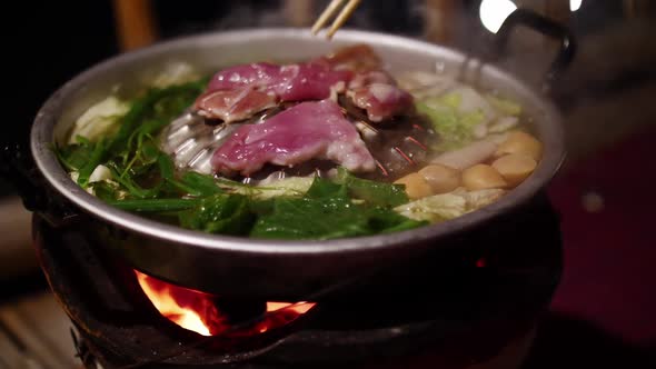 Thai barbeque style. Grilled meats and boiled vegetables on frying pan.