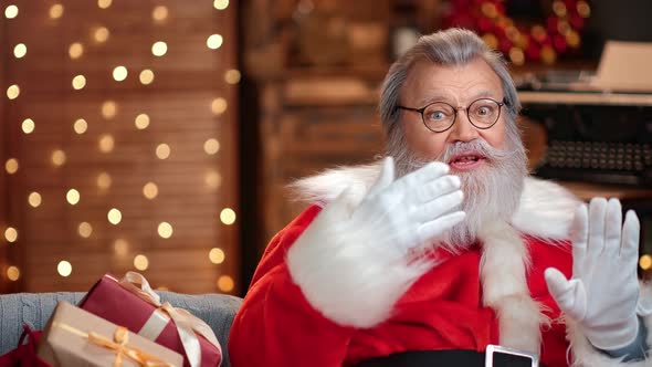 Portrait of Male Santa Claus Speaking Congratulation Xmas Eve