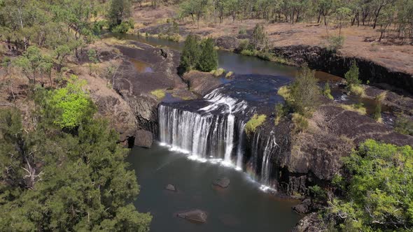 Millstream Falls waterfall backward aerial in Atherton Tablelands, Queensland, Australia