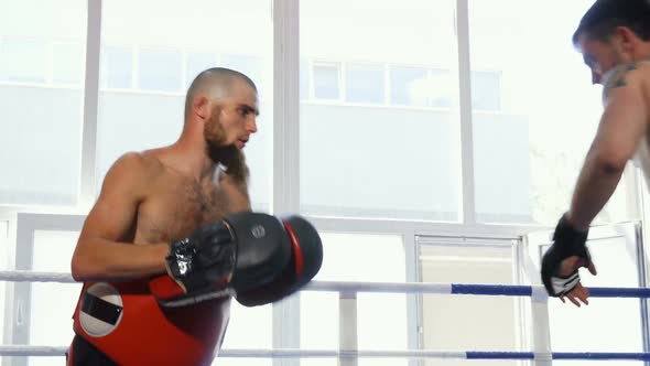 Shot of Two Male Mma Fighters Practicing Together