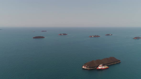 Barge with Coal in the Sea