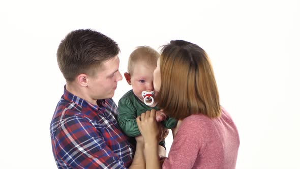 Parents with Their Cute Baby Son. White